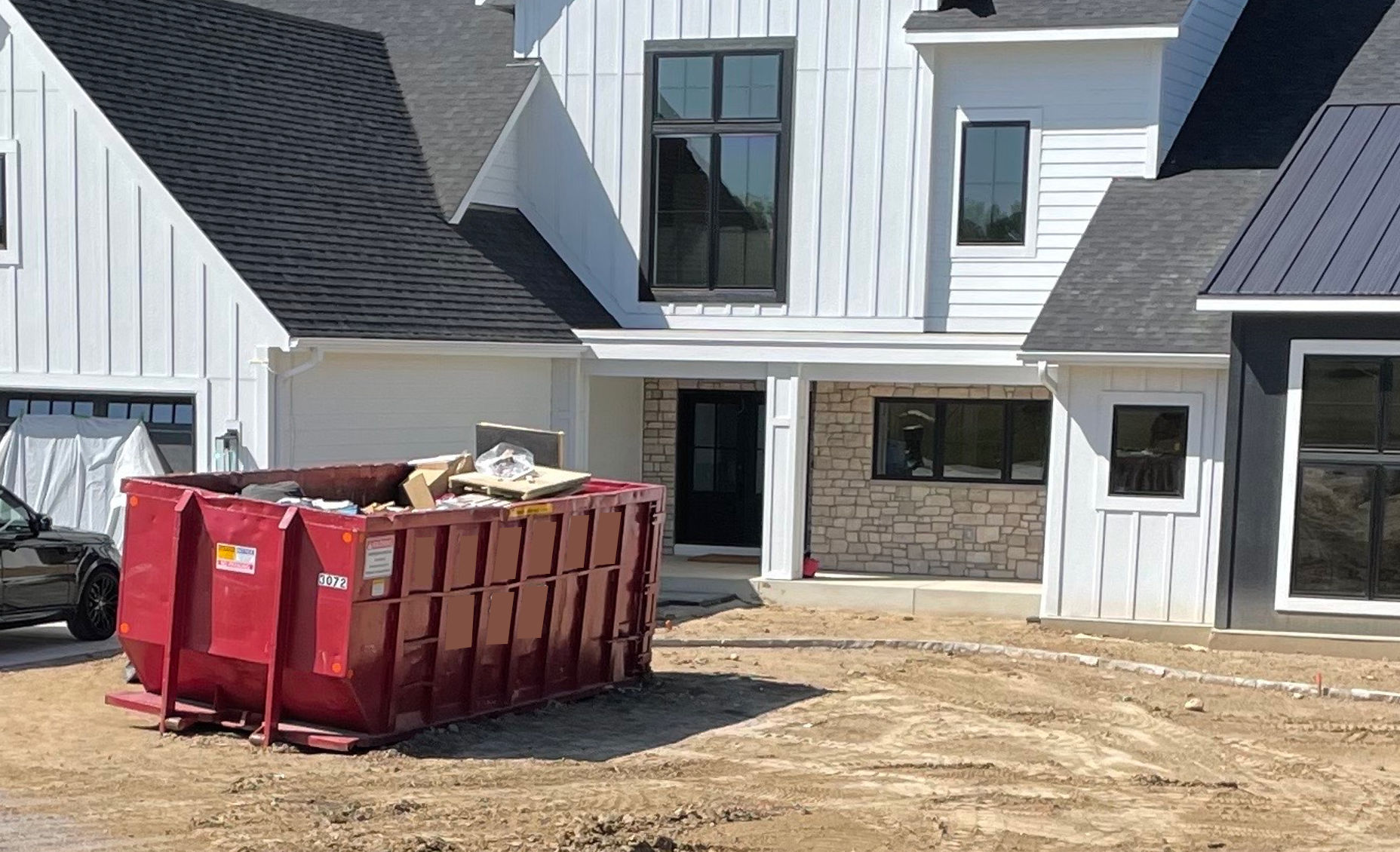 Our larger red dumpsters being used for landscaping in Lakeville MN